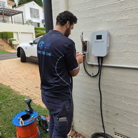 Electrician installing Ocular LTE Plus EV Charger