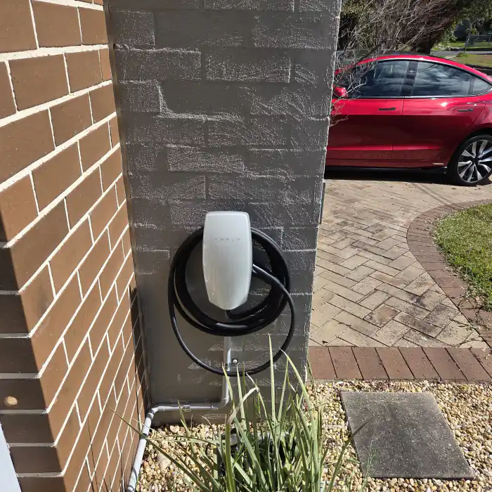 Tesla Wall Connector installed on garage wall