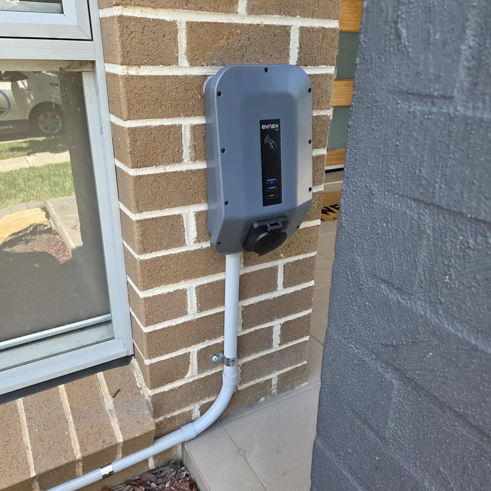 Evnex X22 installed on a timber wall for electric vehicle charging